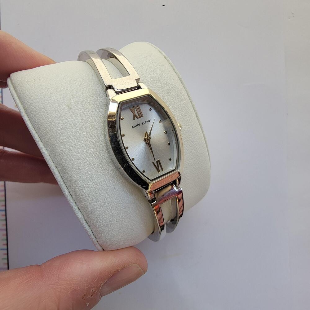 Anne Klein Womens Watch 32mm Silver Dial Silver Case Gold Bezel Bangle Quartz